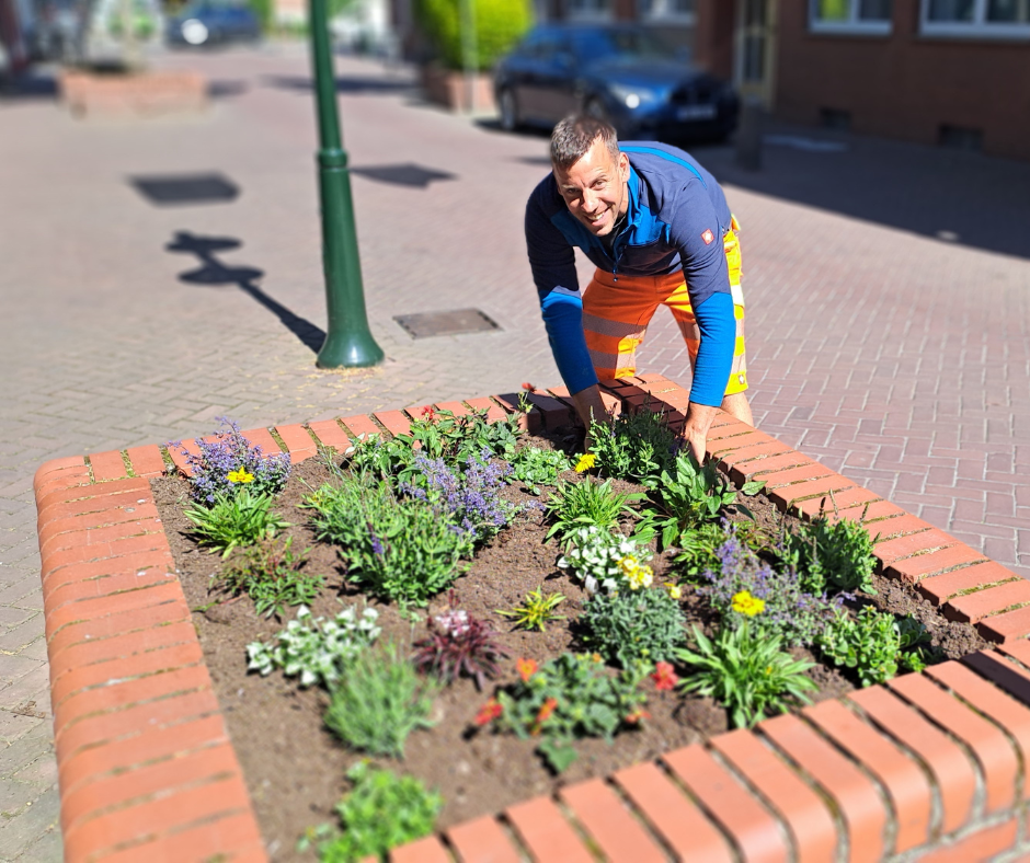 Depot employee plants raised flower bed