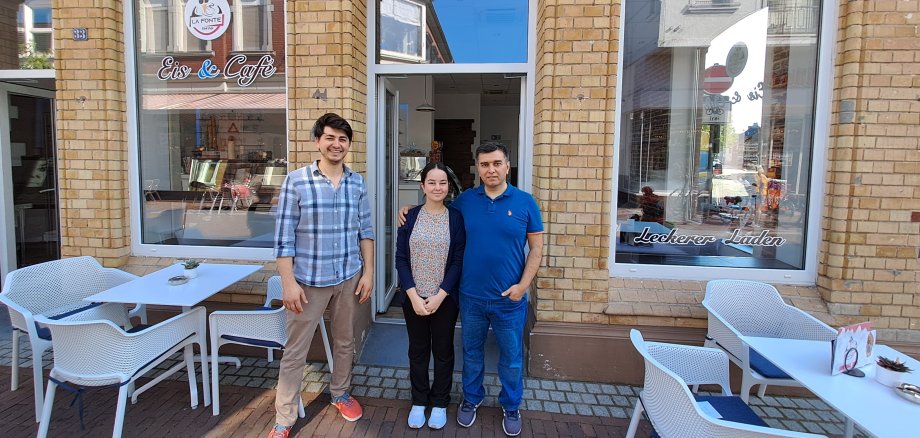 Operators of La Fonte stand in front of their new store.