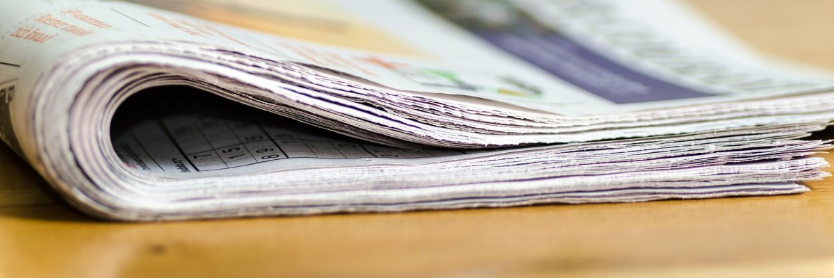 A newspaper lying on its side